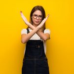 Woman making arms into an x